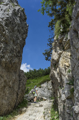 woman walking on the Road of 52 galleries, Veneto, Italy / Strada delle 52 gallerie (Road of 52...