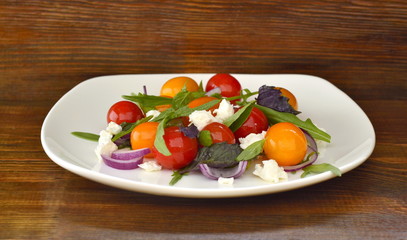 Green salad with cherry tomatoes and cottage cheese