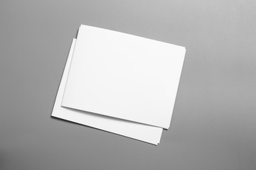 Blank portrait mock-up paper. brochure magazine isolated on gray, changeable background / white paper isolated on gray