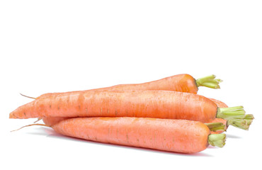 A few fresh raw orange carrots on a white isolated background. close-up