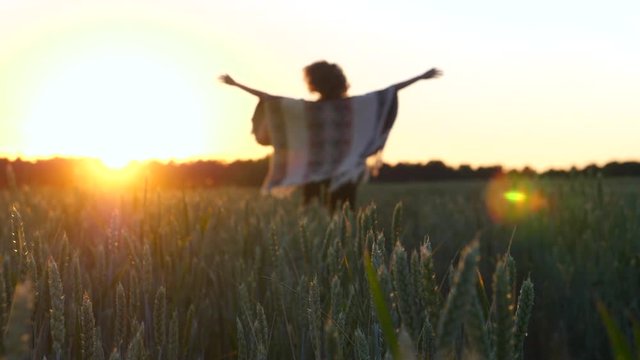 Happy Healthy Lifestyle Concept. Carefree Woman In A Wheat Field At Sunset.