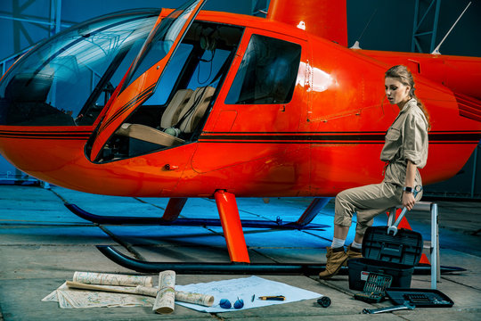 Beautiful Female Helicopter Mechanic At Work. Feminism