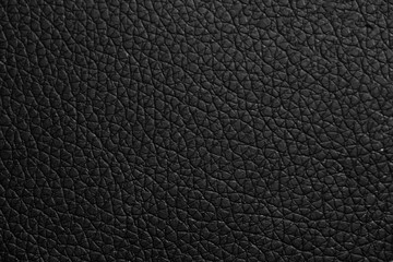 black leather texture or background with spotlight, dark tone.