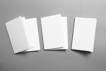 Blank portrait mock-up paper. brochure magazine isolated on gray, changeable background / white paper isolated on gray
