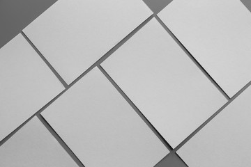 Obraz premium Blank portrait mock-up paper. brochure magazine isolated on gray, changeable background / white paper isolated on gray
