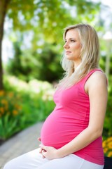 Portrait of a Pregnant Woman in a Park