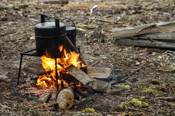 At the stake, soup is cooked and tea is heated. In nature in the hike