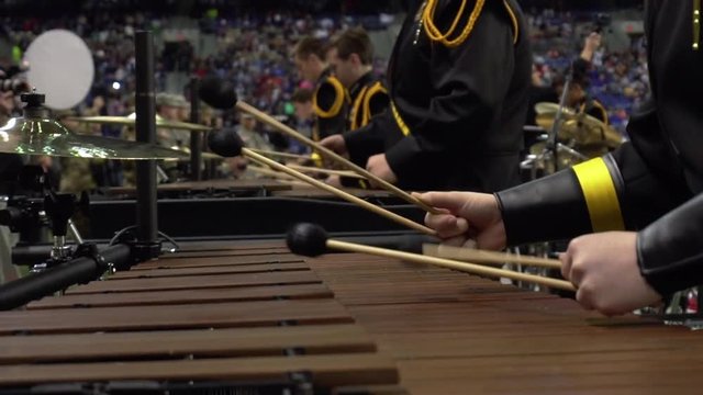 Close of a marimba played by the percussion section of a marching band