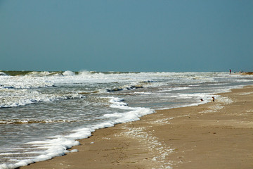 Waves with marine foam during storm at Azov sea in Ukraine.Cloudy stormy weather.