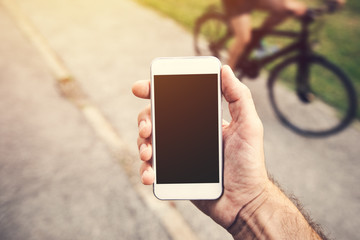 Hand with smartphone mock up copy space