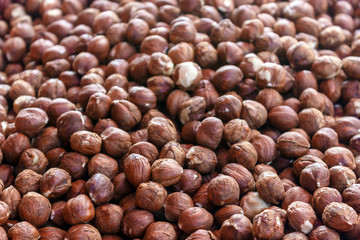 Nut background of hazelnut fruits. Food background. Top view of hazelnut nuts.