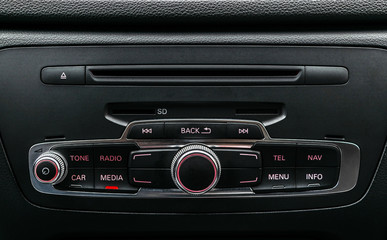 Obraz na płótnie Canvas Modern Luxury car inside. Interior of prestige car. Black Leather. Car detailing. Dashboard. Media, climate and navigation control buttons. Sound system. Modern car interior details.