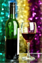new years party with bottle of wine on a table and a glass of wine