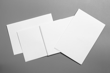 Blank portrait mock-up paper. brochure magazine isolated on gray, changeable background / white paper isolated on gray