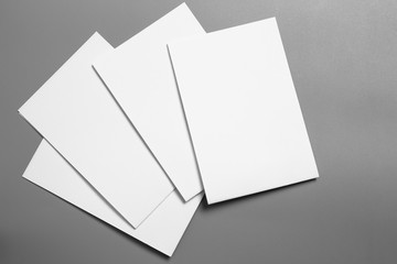 Blank portrait mock-up paper. brochure magazine isolated on gray, changeable background / white paper isolated on gray