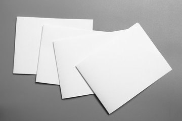 Blank portrait mock-up paper. brochure magazine isolated on gray, changeable background / white paper isolated on gray