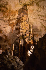 View of stalactites and stalagmites in an underground cavern - Postojna cave in Slovenia