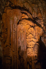 View of stalactites and stalagmites in an underground cavern - Postojna cave in Slovenia