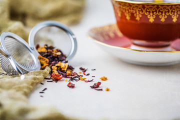Royal Albert Fine Bone China Red Tea Cup and Saucer with Herbal Tea and Tea Infuser on Gray...