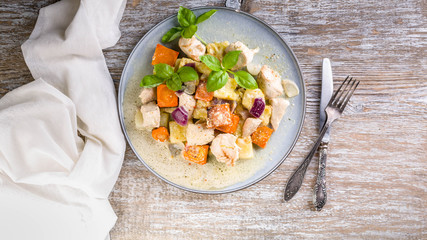 Turkey stew with vegetables in creamy sauce. Top view. Healthy and wholesome food