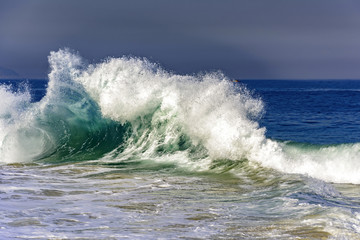 Big wave breaking on Ipanema beach during brazilian summer