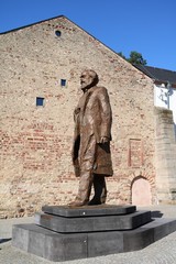 Karl Marx statue monument on the Simeonstiftplatz in Trier, Germany