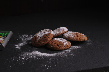 oatmeal cookies on a black table in castor sugar