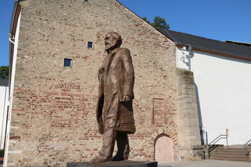 Bronze statue Karl Marx on the Simeonstiftplatz in his birthplace Trier, Germany