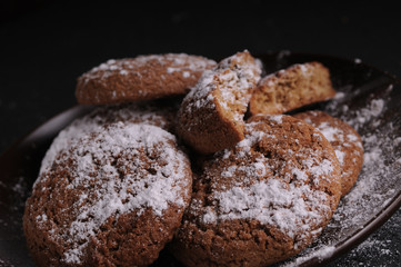 oatmeal cookies on a black table in castor sugar