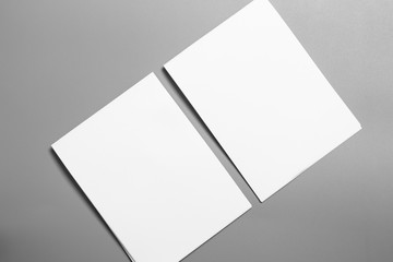 Blank portrait mock-up paper. brochure magazine isolated on gray, changeable background / white paper isolated on gray