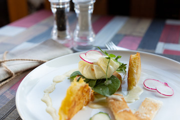 Healthy breakfast food. Delicious benedict for real gourmet. Beautifully served benedict on white tray in restaurant.