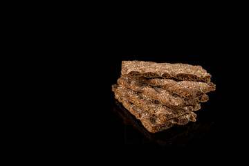 Crisp Bread, Slices of Scandinavian Crisp Bead on a reflective surface isolated on black background with place for you text