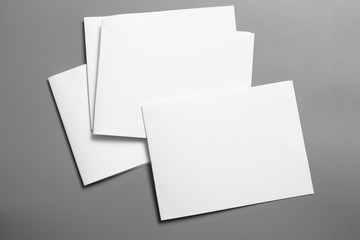 Blank portrait mock-up paper. brochure magazine isolated on gray, changeable background / white paper isolated on gray