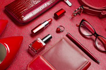 Woman red accessories, jewelry, cosmetic, shoes and other luxury objects on leather background,...