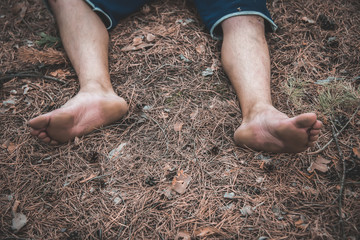corpse of a man in the woods