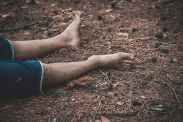 corpse of a man in the woods