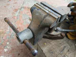 Old vice on wooden base