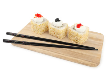 set of sushi roll on a wooden plate, isolated on white close-up