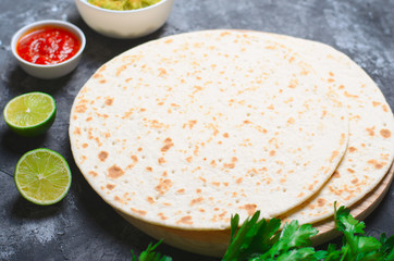 Plain Tortillas with Tomato Salsa, Guacamole and Fresh Parsley on Dark Background, Wheat Tortillas, Mexican Food