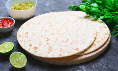 Plain Tortillas with Tomato Salsa, Guacamole and Fresh Parsley on Dark Background, Wheat Tortillas, Mexican Food
