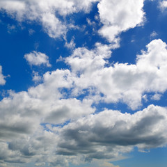 Naklejka na ściany i meble Light cumulus clouds in the blue sky.