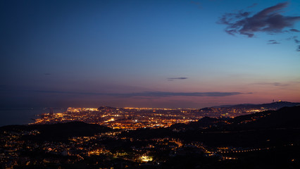 Skyline view of Barcelona City, Spain from mountain top during sunset
