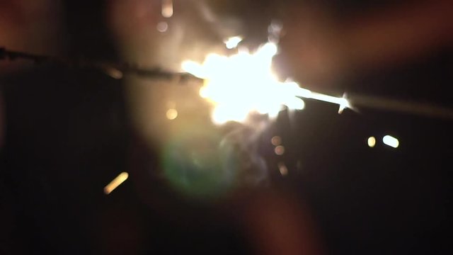 Close up of a sparkler in slow motion at night