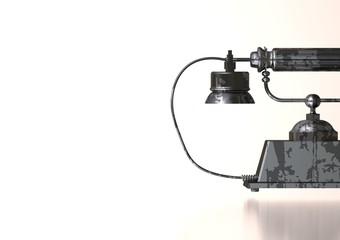 Silver and black disk phone on white