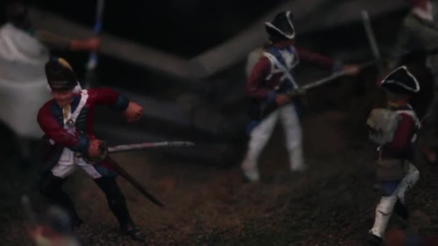 Close up of British toy figurines posed to battle
