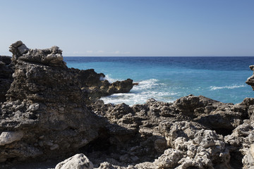 Fototapeta na wymiar Albanian coast.beautiful view on the rock sea shore,blue sea and wave.