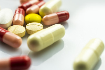 Pharmacy theme, medicines tablets on white table.