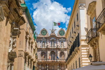 Scenic sight in Trapani old town with the Palazzo Senatorio in the background. Sicily, Italy.  - obrazy, fototapety, plakaty