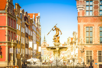 The Neptune fountain, bronze statue of the Roman God of the Sea in old town of Gdansk (Danzig), Poland, retro toned © neirfy