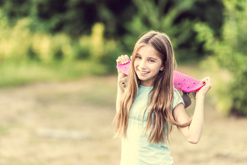 teenage girl holding her pink board